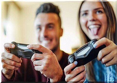 Couples playing video games as a hobby together.