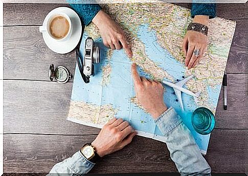 Couple looking at map - tireless travelers