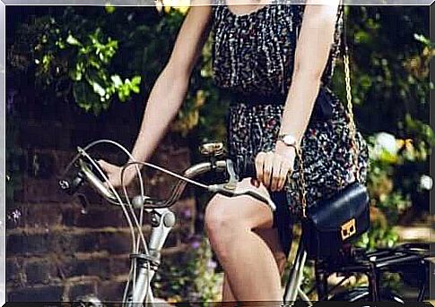 A woman who rides a bicycle.