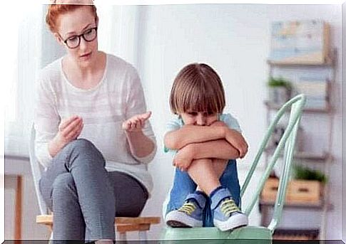 A woman talking to a child.