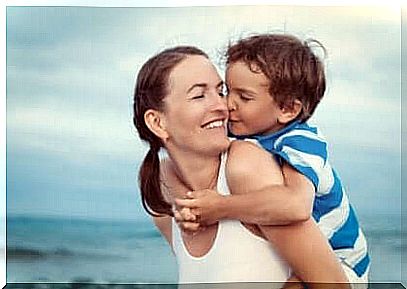 A mother with her son on the beach