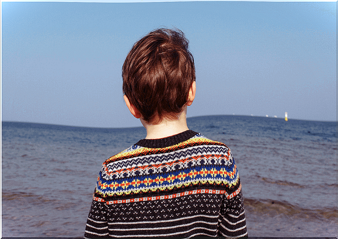 boy looking at water taking moral judgments.