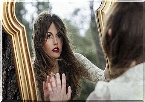 Woman in front of mirror