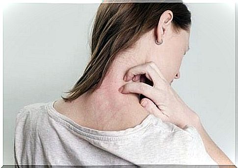 Woman scratches on the neck where she has a rash.  Maybe a sign of somatic feelings.