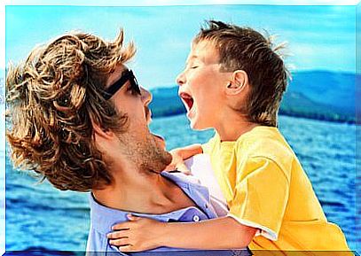 father and son laughing