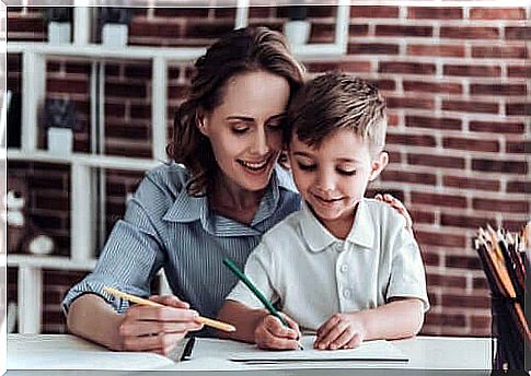 A mother helping her son do his homework