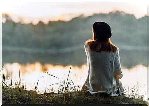 Woman by a water.