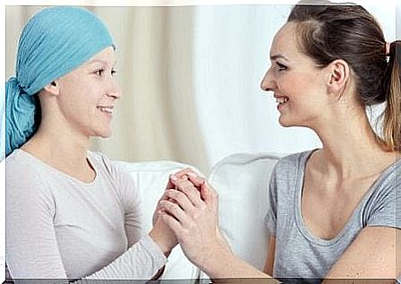 A therapist supports a patient with breast cancer