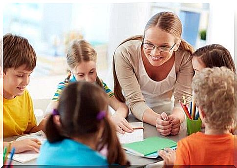 A teacher and some children.