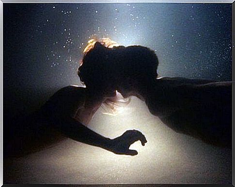 Couple kissing underwater