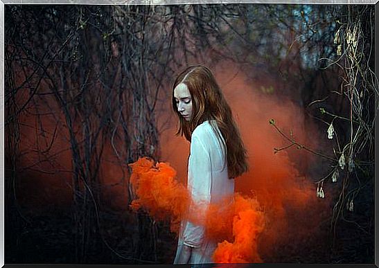 Girl in red smoke